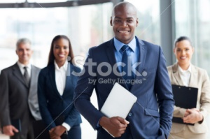 stock-photo-36411644-african-businessman-with-group-of-businesspeople